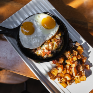 Eggs and potatoes in skillet at Milestone in Mystic 